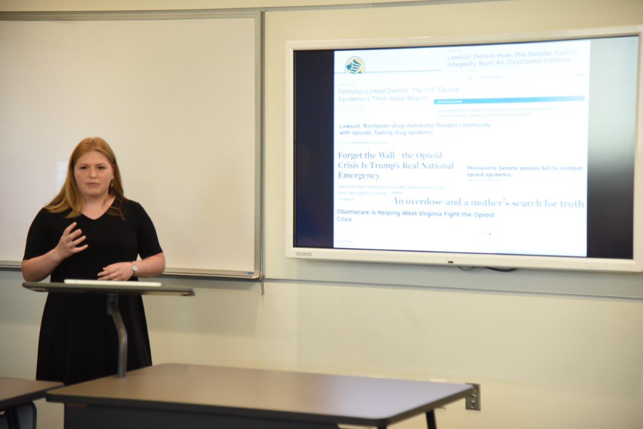 Amanda Luce_an award winning_making a presentation on A Numerical Analysis of the Opiod Epidemic